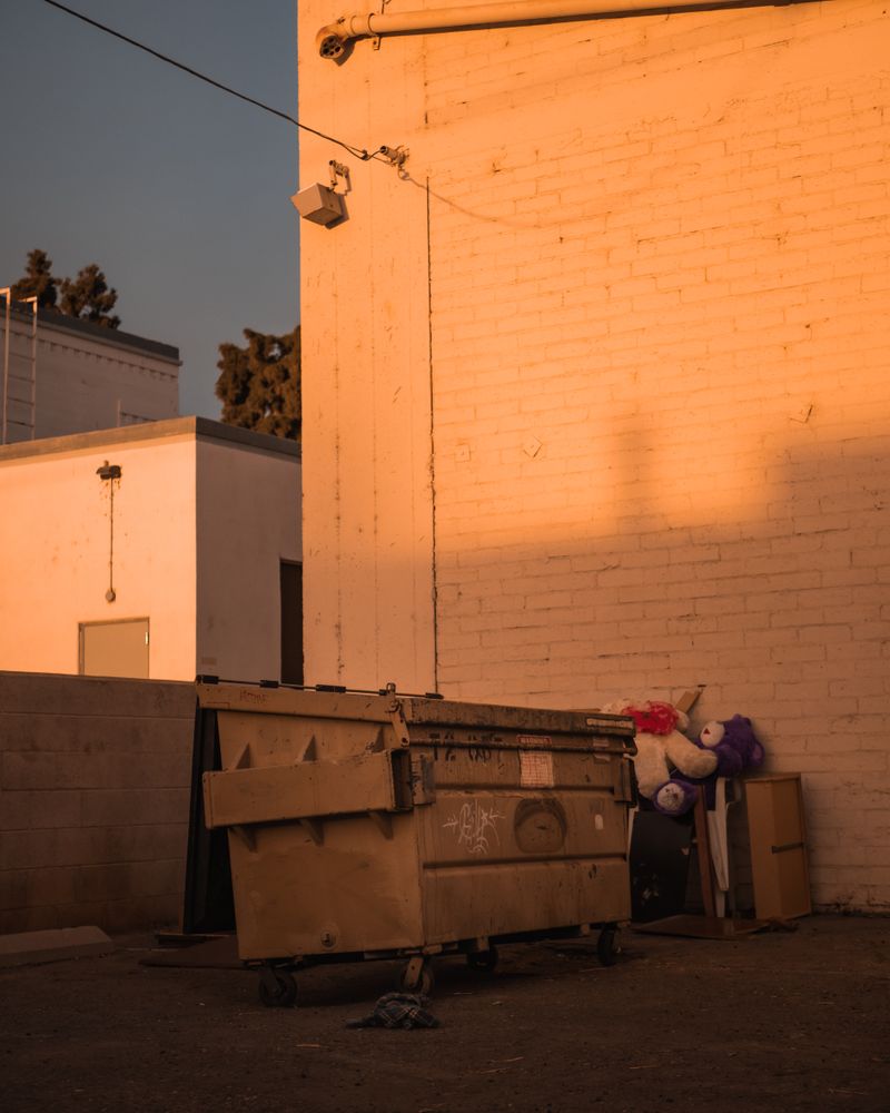 Dumpster behind a commercial building in Phoenix at sunset